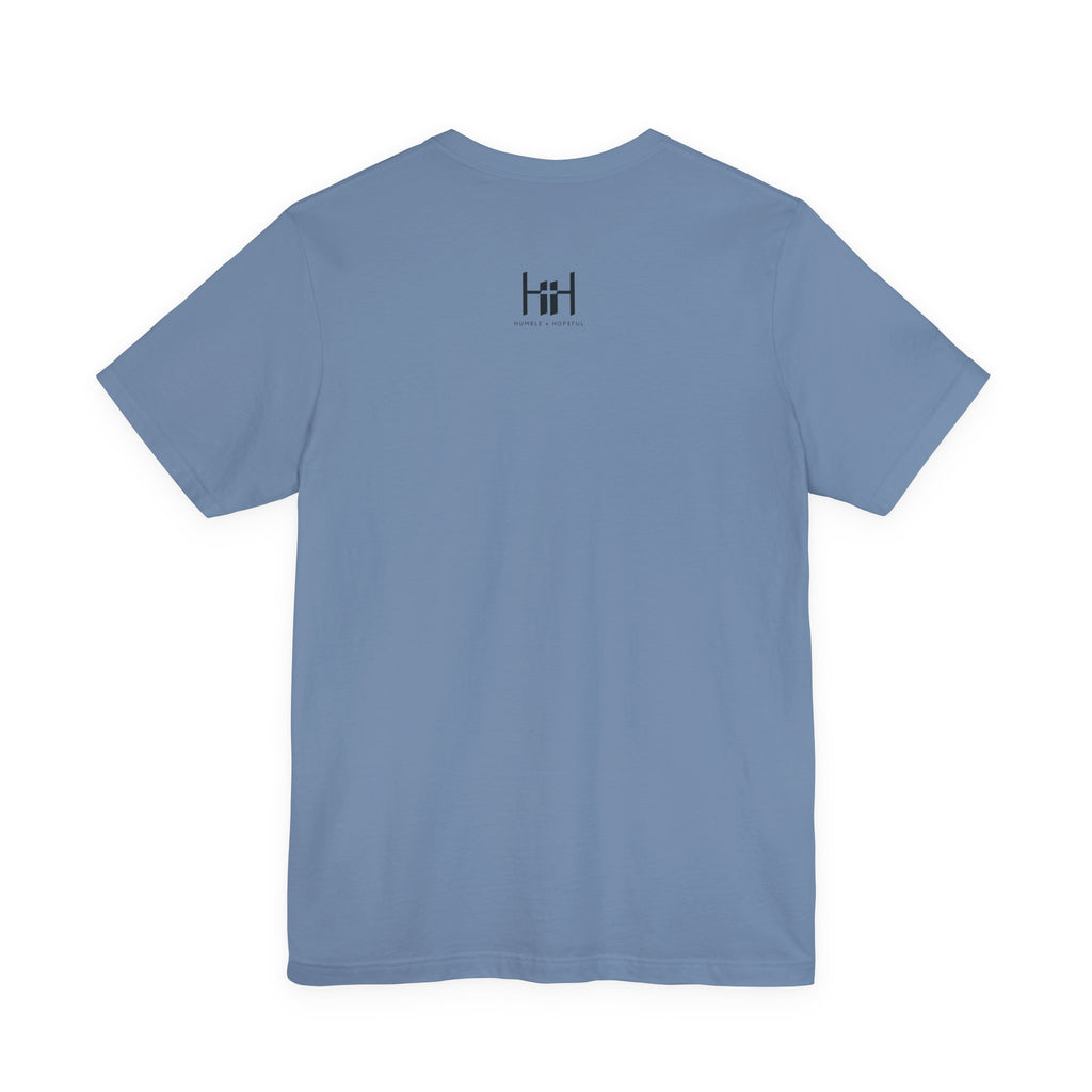 Plain blue t-shirt with a 'Humble + Hopeful' on a white background