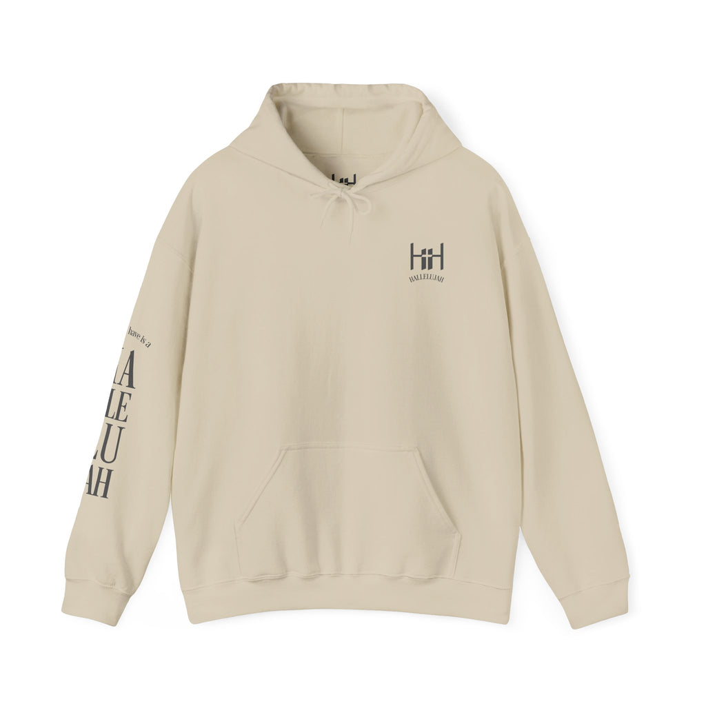 Sand colored hoodie with a Humble + Hopeful logo and Hallelujah on the sleeve on a white background