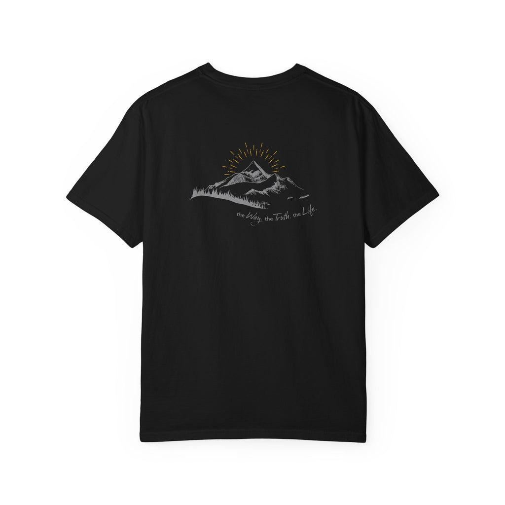A black t-shirt with a mountain with a rising sun and the Way, the Truth, the Life text printed underneath the graphic on a white background.