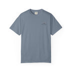 Blue jean color t-shirt with small mountain design and 'humble and hopeful' text on a white background.