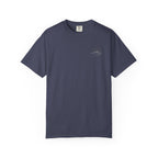 Denim color t-shirt with small mountain design and 'humble and hopeful' text on a white background.