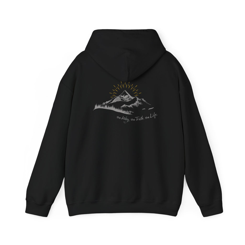 A black hooded sweatshirt shown from the back, with a mountain with a rising sun and the Way, the Truth, the Life text printed underneath the graphic on a white background.