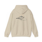 A beige hooded sweatshirt shown from the back, with a mountain with a rising sun and the Way, the Truth, the Life text printed underneath the graphic on a white background.