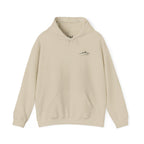 Beige pullover hoodie with a small mountain and humble and hopeful text on a white background.