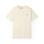 Ivory t-shirt with small mountain design and 'humble and hopeful' text on a white background.