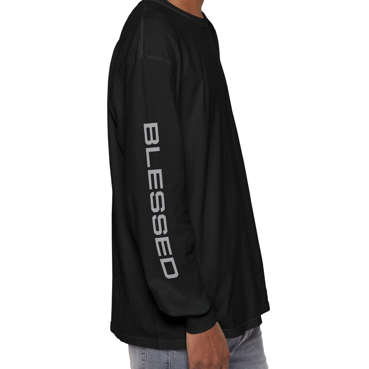 A man wearing a black long-sleeve t-shirt with 'BLESSED' printed vertically in white on the left sleeve, shown from a side profile view against a plain white background.