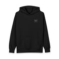 Black hoodie with 'Humble+Hopeful' logo on the back against a white background