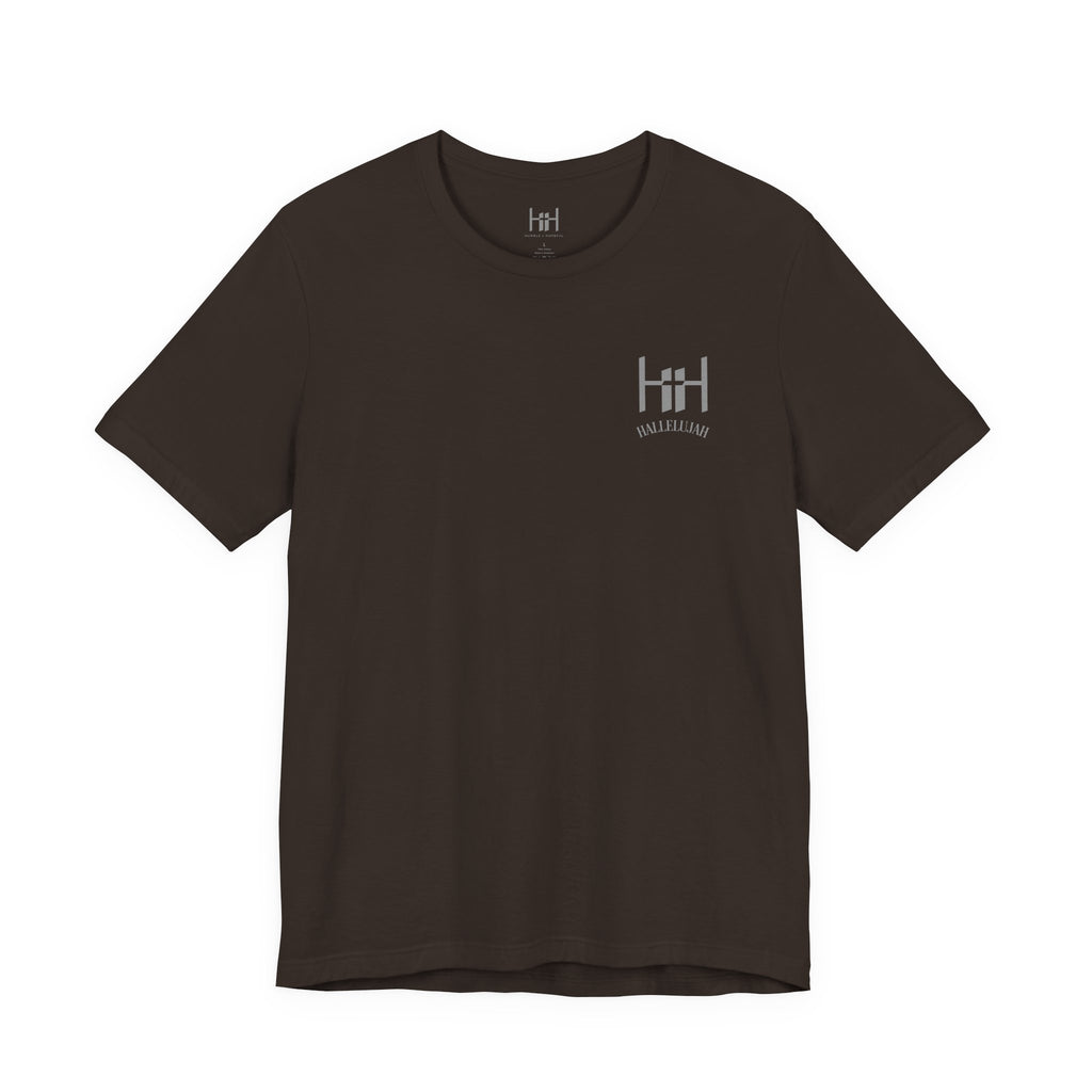 Brown t-shirt with the Humble + Hopeful logo on it on the white background