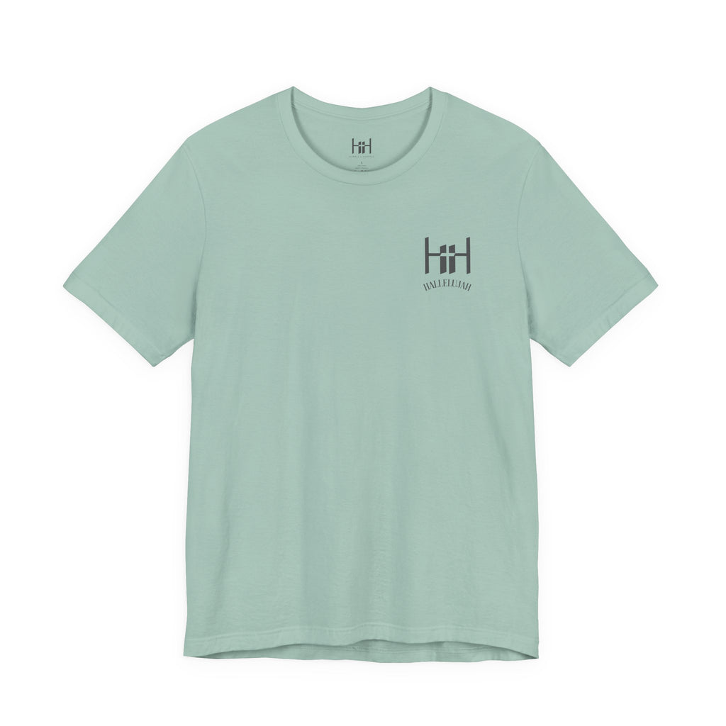 the front of a dusty blue t-shirt with the Humble + Hopeful logo on it