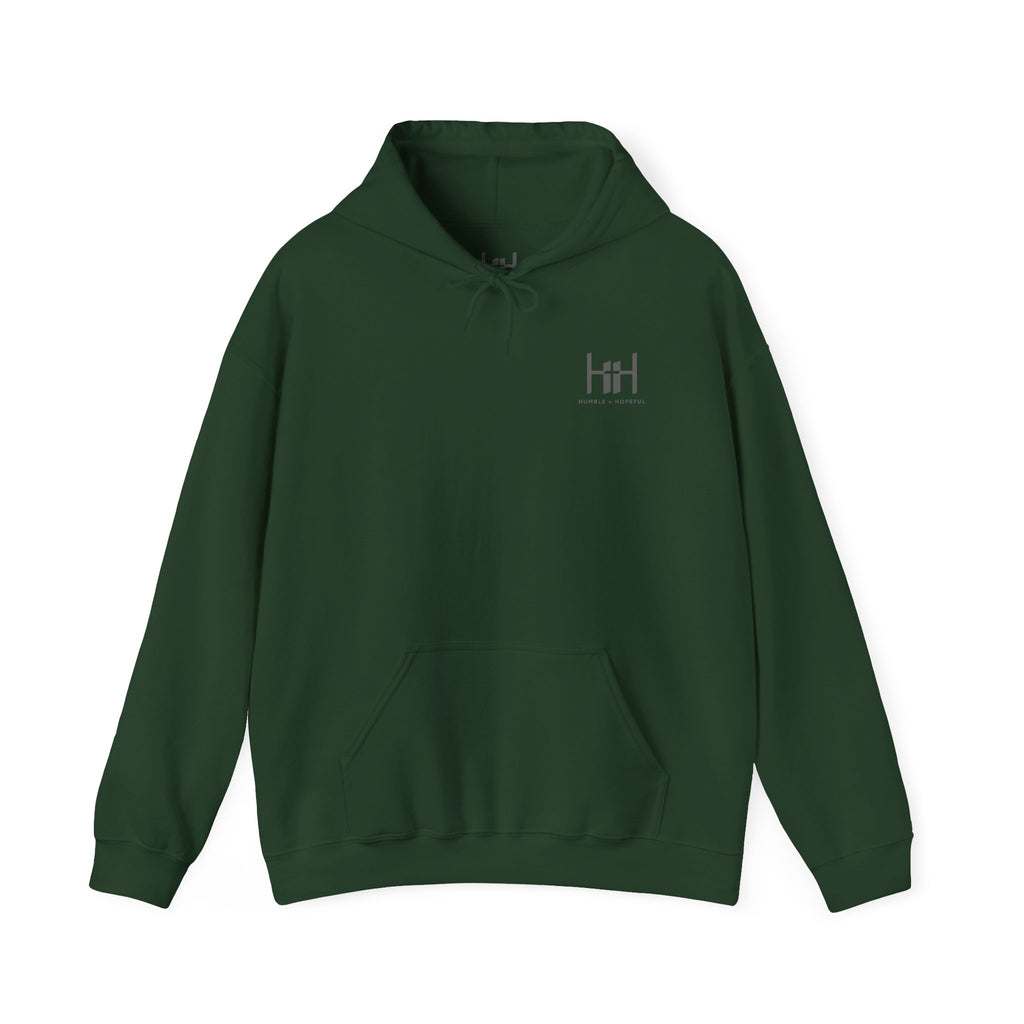 Forest Green hoodie with 'Humble+Hopeful' logo on the back against a white background