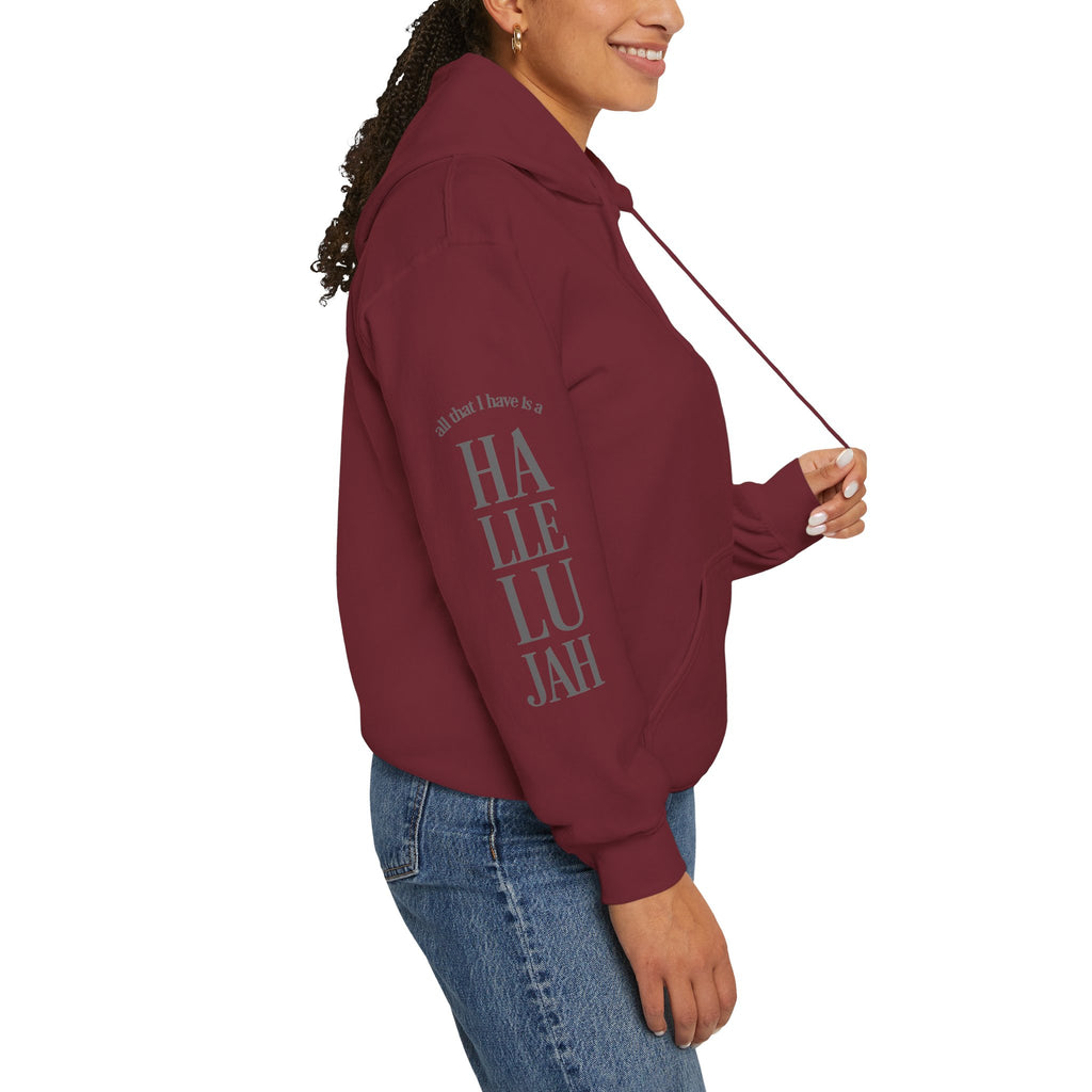 garnet colored hoodie with a Humble + Hopeful logo on the front and Hallelujah on the sleeve on a white background