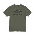 green t-shirt with 'Humbled+Forgiven' text on the back against a white background