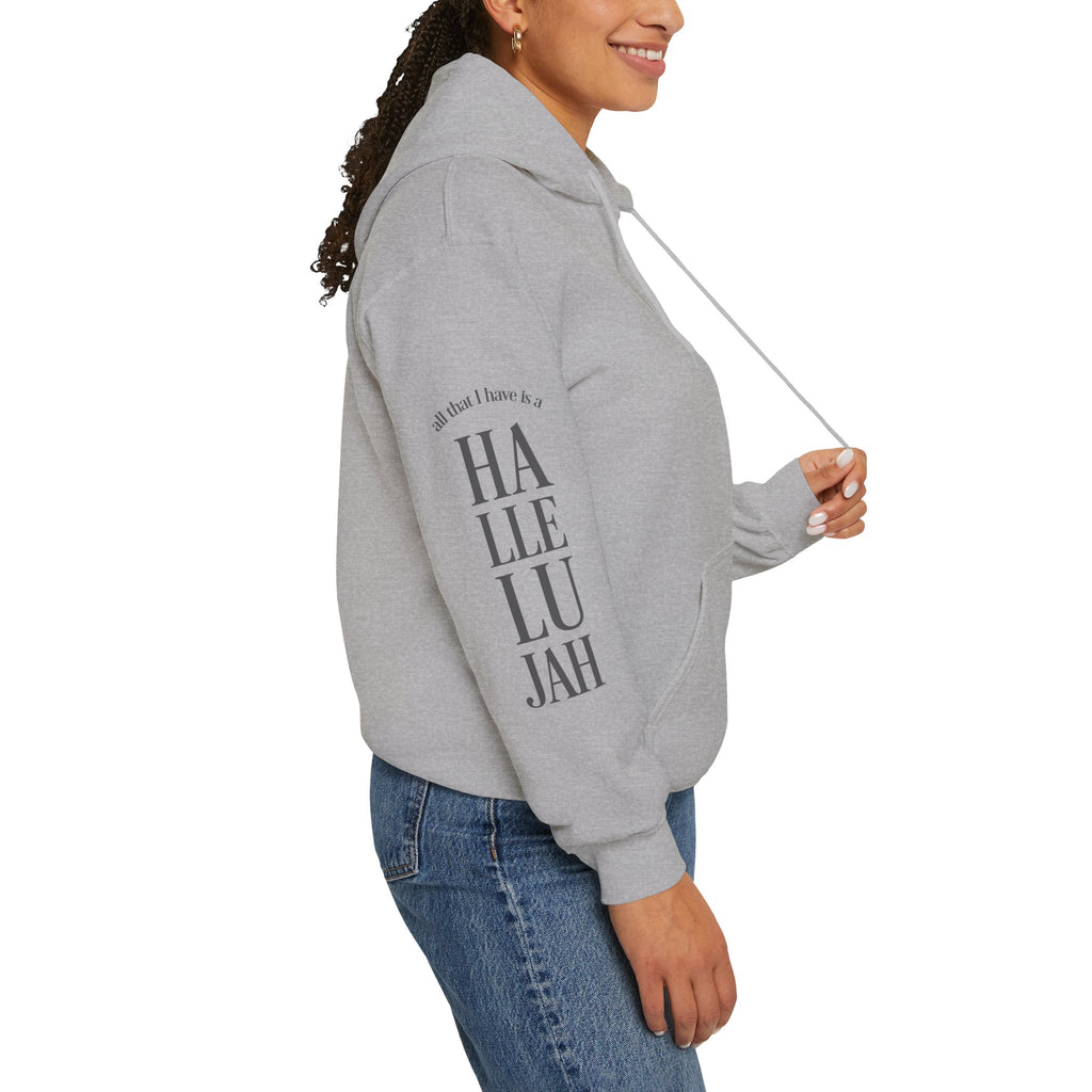 Light grey colored hoodie with a Humble + Hopeful logo on the front and Hallelujah on the sleeve on a white background