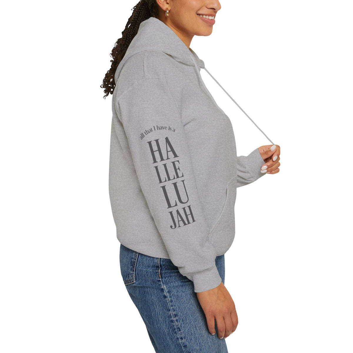 Light grey colored hoodie with a Humble + Hopeful logo on the front and Hallelujah on the sleeve on a white background