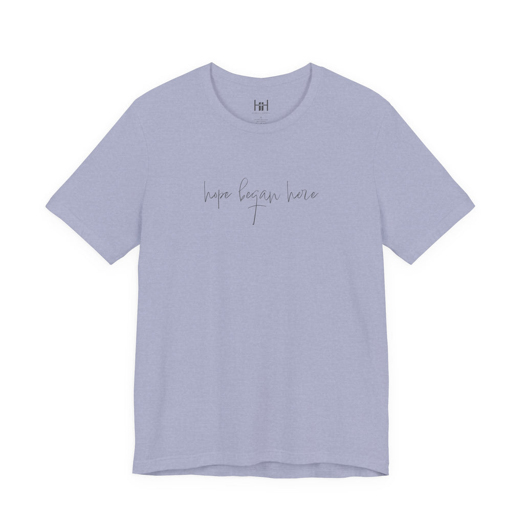 Light blue t-shirt with 'hope began here' text on a white background
