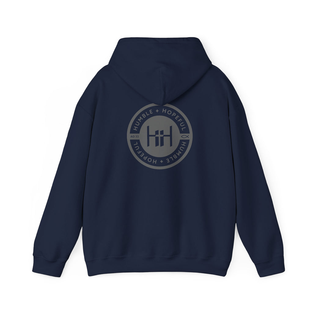 Navy hoodie with 'Humble+Hopeful' logo on the back against a white background