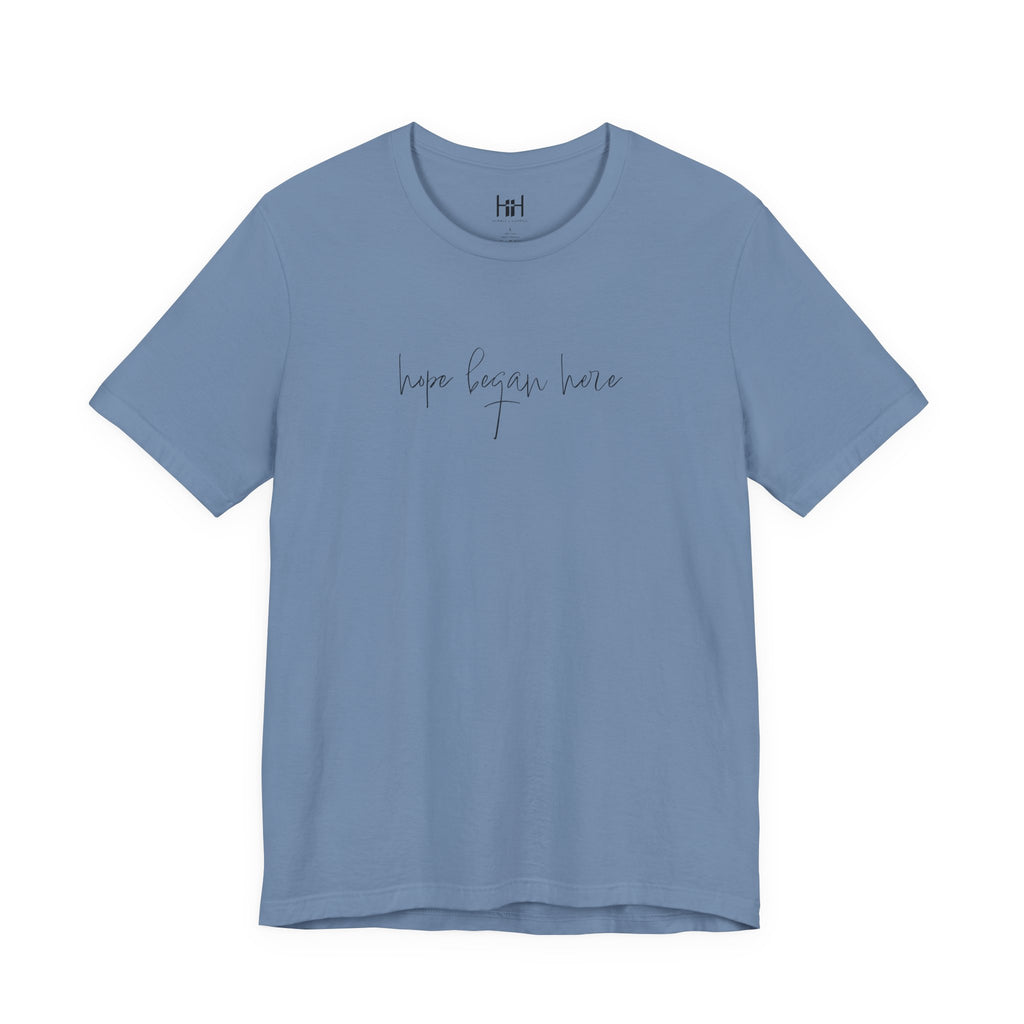 steel blue t-shirt with 'hope began here' text on a white background