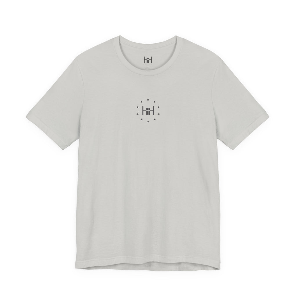 silver t-shirt with the Humble + Hopeful logo on the front
