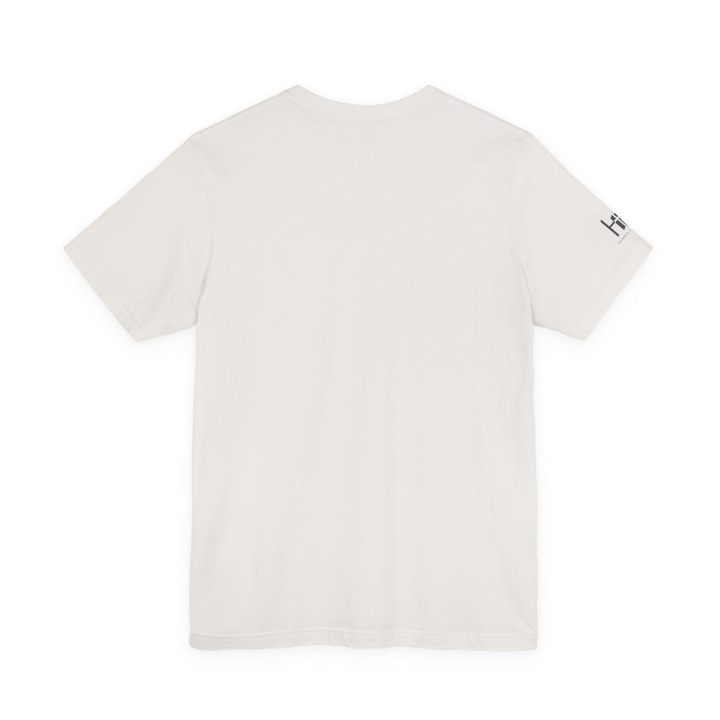 A short-sleeve crewneck t-shirt in off-white, shown from the back with a small black graphic logo on the left sleeve, set against a plain white background.