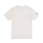 A short-sleeve crewneck t-shirt in off-white, shown from the back with a small black graphic logo on the left sleeve, set against a plain white background.
